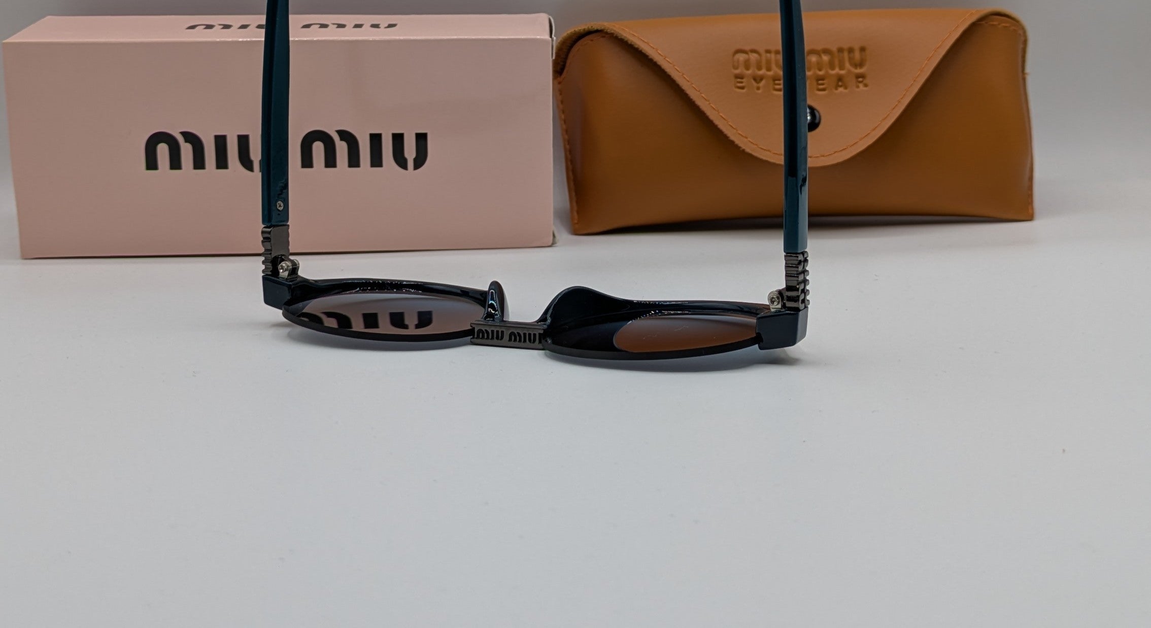 MIUMIU HALF ROUND