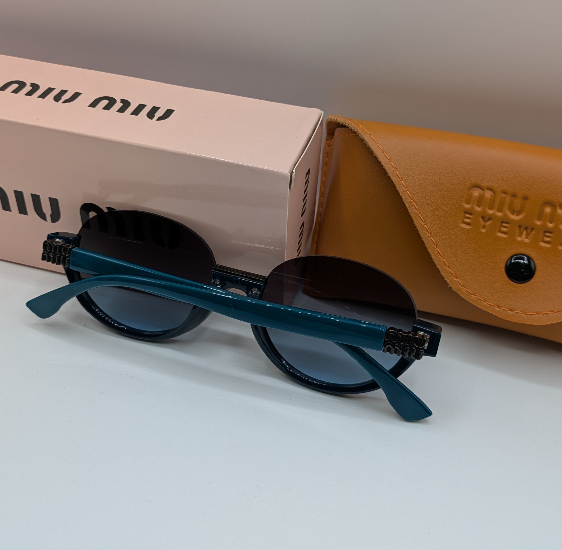 MIUMIU HALF ROUND