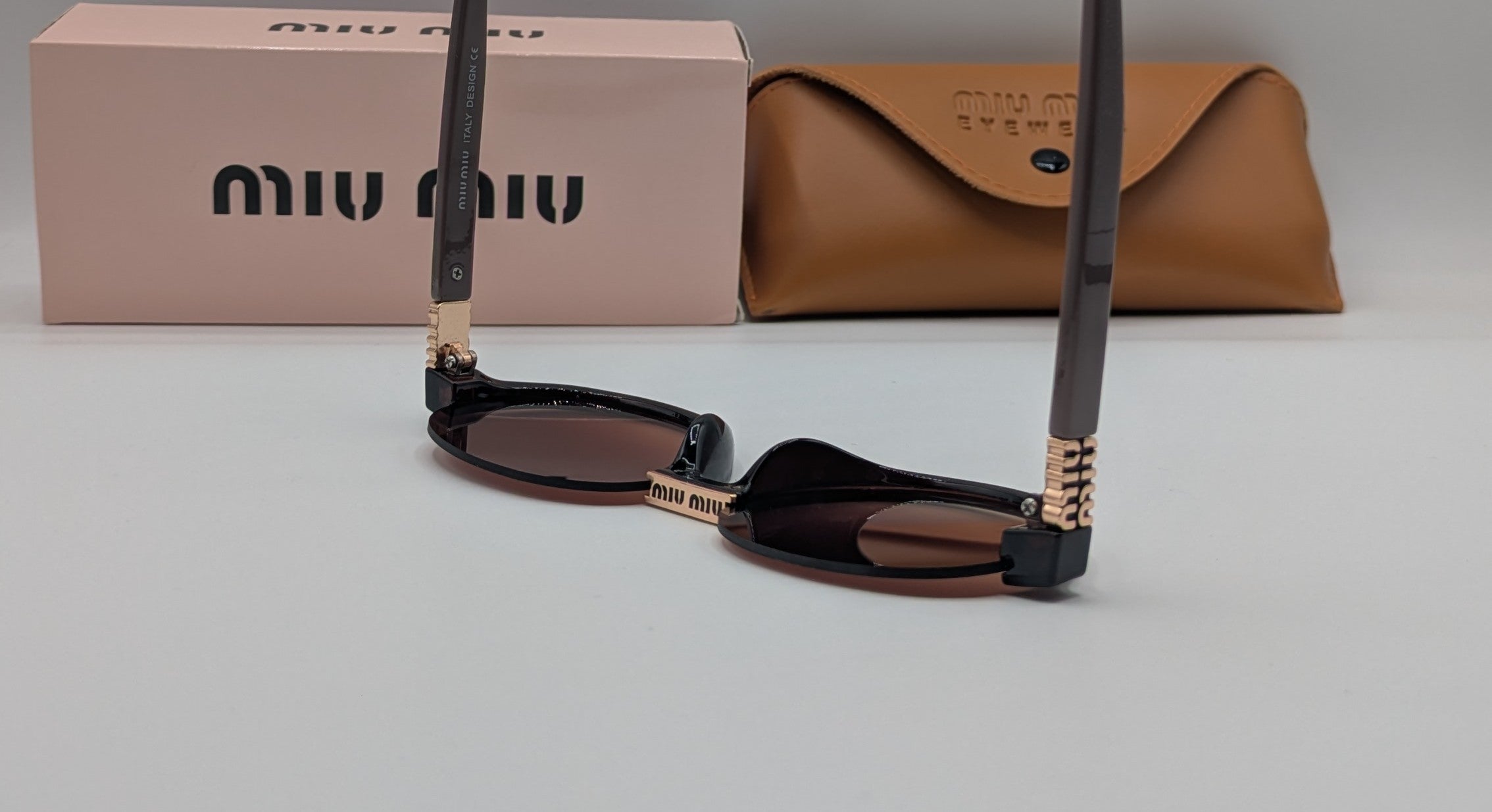 MIUMIU HALF ROUND