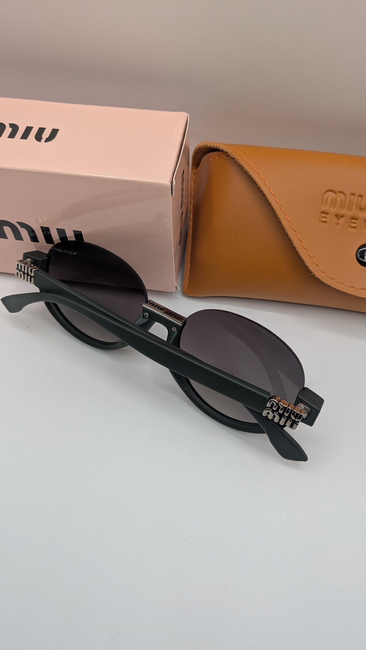 MIUMIU HALF ROUND