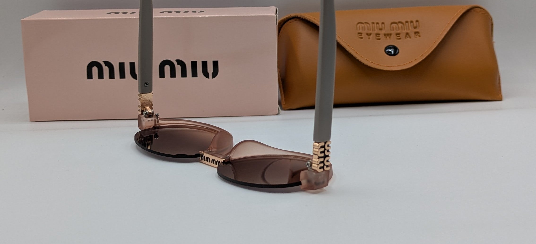 MIUMIU HALF ROUND